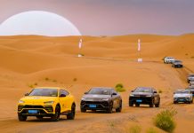Lamborghini leads 42 supercars and SUVs across a desert in Northwestern China
